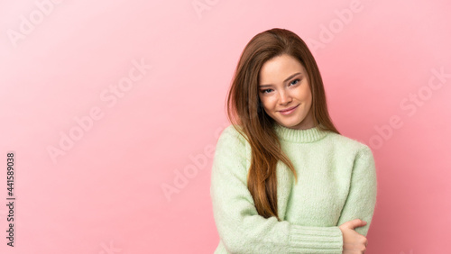 Teenager girl over isolated pink background laughing © luismolinero