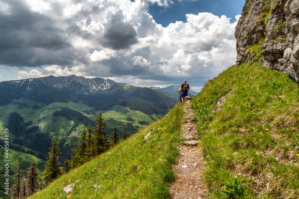 Hikers on hiking trail under hill Ohniste in Low Tatras mountains, Slovakia