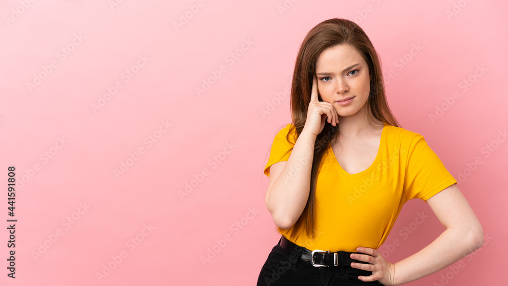 Teenager girl over isolated pink background thinking an idea Teenager girl over isolated pink background thinking an idea