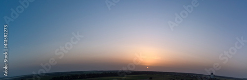 Orange sunset. Panorama of the evening sky.