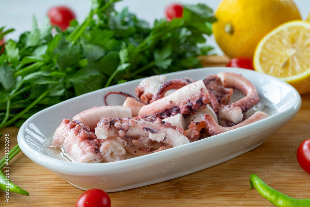 Octopus salad on wooden background. seafood dishes. Local name ahtapot salatası