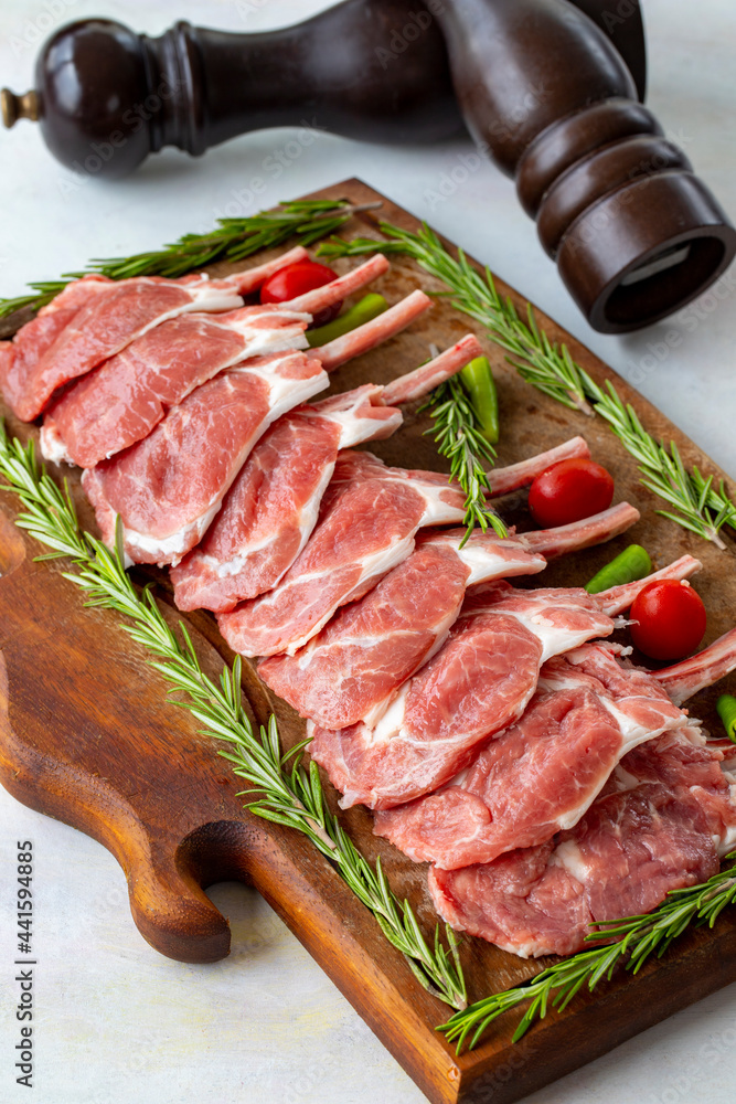 Lamb chops on wooden background