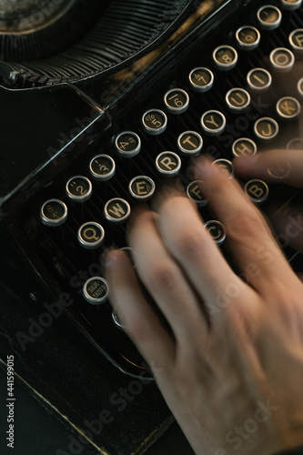 Crop hands using typewriter photo