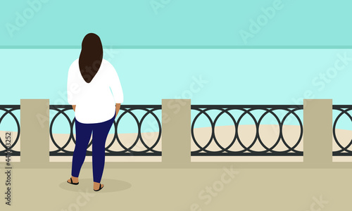 Fat female character stands on the embankment and looks at the sea