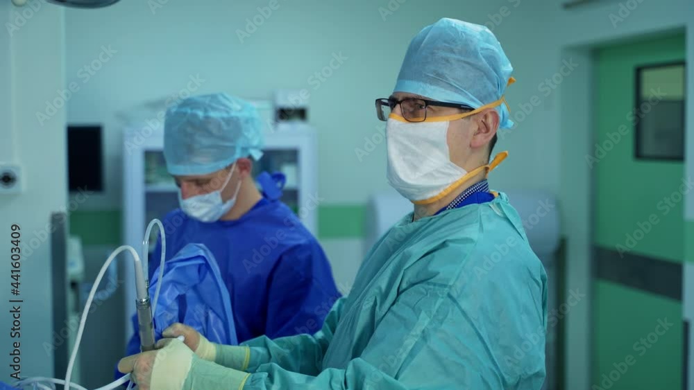 Professional surgery doctors working in operation ward. Emergency hospital surgeons. Professional surgery doctors working in operation ward. Emergency hospital surgeons.