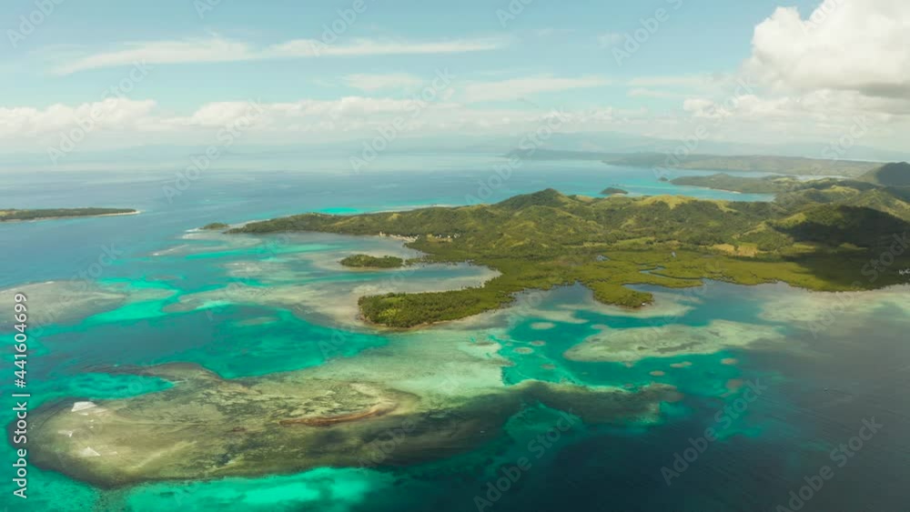 Tropical islands in turquoise lagoon and coral reef water, aerial view. Bucas grande, Philippines. Summer and travel vacation concept. Tropical islands in turquoise lagoon and coral reef water, aerial view. Bucas grande, Philippines. Summer and travel vacation concept.