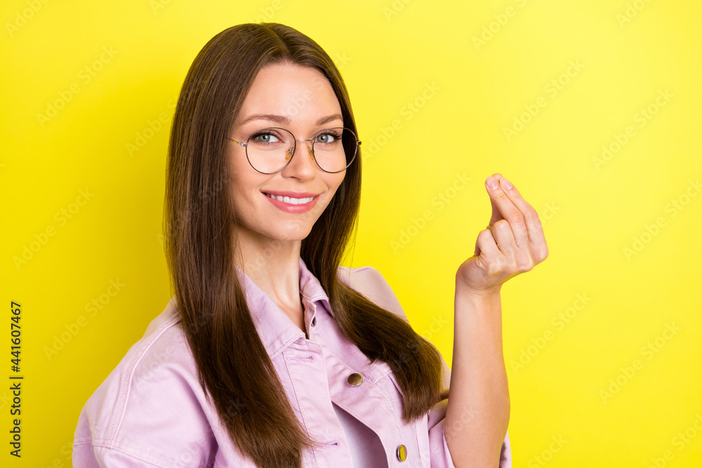 Photo of nice brunette hairdo young lady ask wear spectacles pink shirt isolated on yellow color background Photo of nice brunette hairdo young lady ask wear spectacles pink shirt isolated on yellow color background