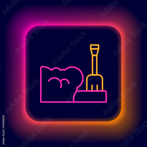Glowing neon line Shovel in snowdrift icon isolated on black background. Colorful outline concept. Vector