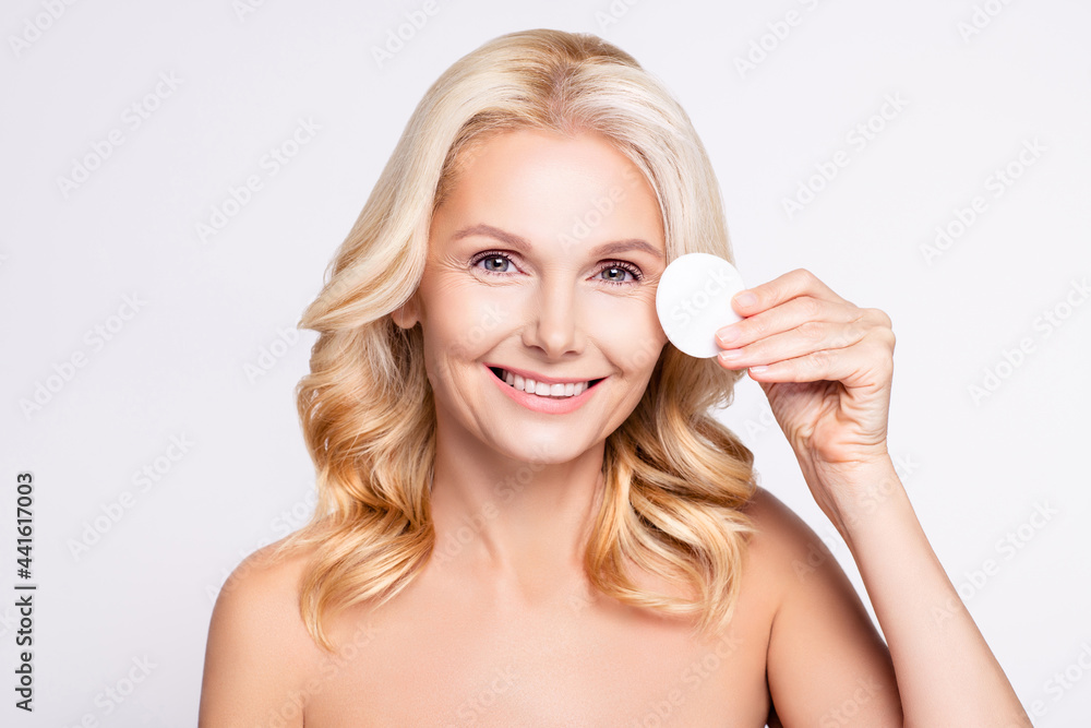Photo of nice blond hairdo elder lady hold disk without clothes isolated on white color background Photo of nice blond hairdo elder lady hold disk without clothes isolated on white color background