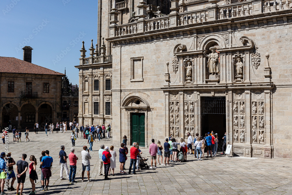 Santiago de Compostela, Spain; june 25, 2021: Tourists and pilgrims waiting in line to enter the Holy door of Santiago de Compostela Cathedral