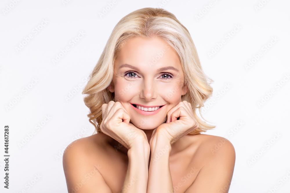 Portrait of attractive cheerful woman with flawless skin vitality beautician isolated over white color background Portrait of attractive cheerful woman with flawless skin vitality beautician isolated over white color background