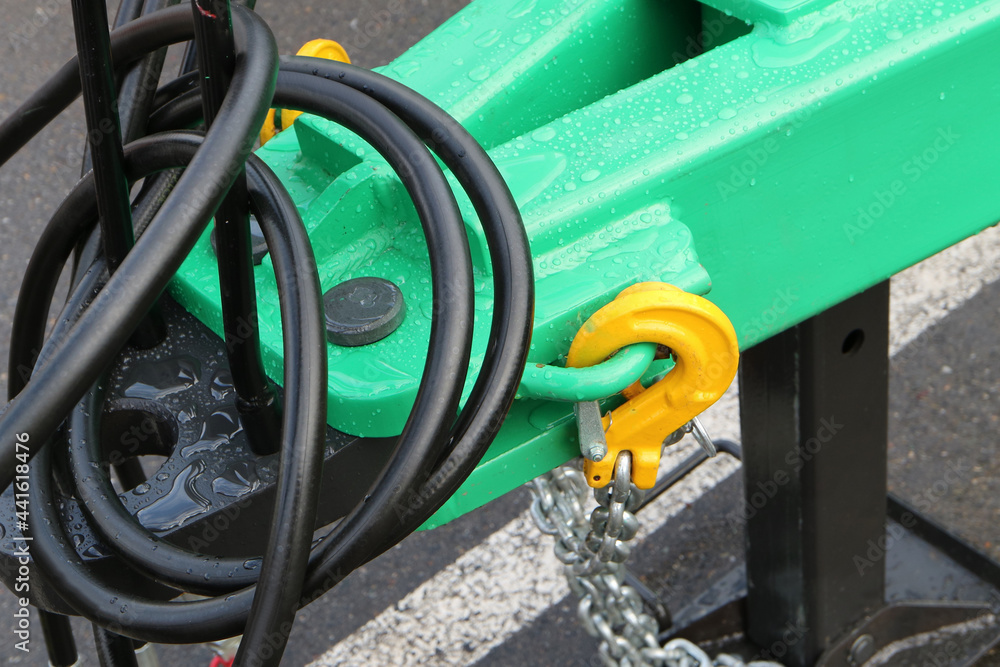 Details and components of agricultural machines. Fragment of an agricultural machine. Coupling. Safety chain and carbine. Details and components of agricultural machines. Fragment of an agricultural machine. Coupling. Safety chain and carbine.