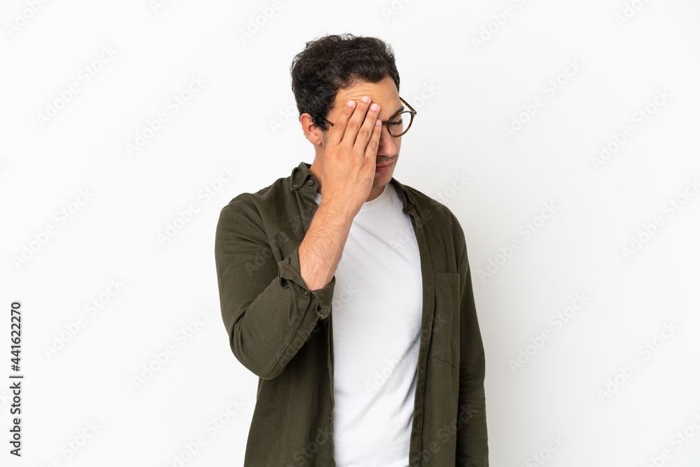 Caucasian handsome man over isolated white background with headache Caucasian handsome man over isolated white background with headache