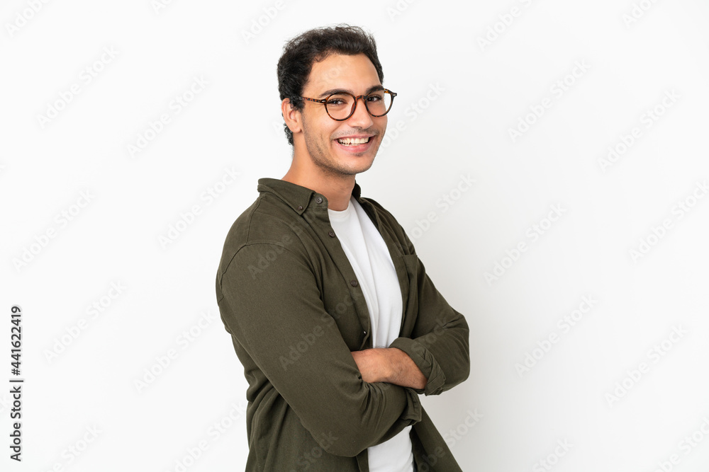 Caucasian handsome man over isolated white background with arms crossed and looking forward