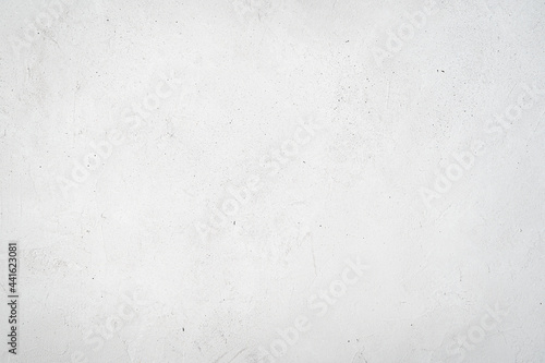 Grey textured concrete background with scratches and drops.