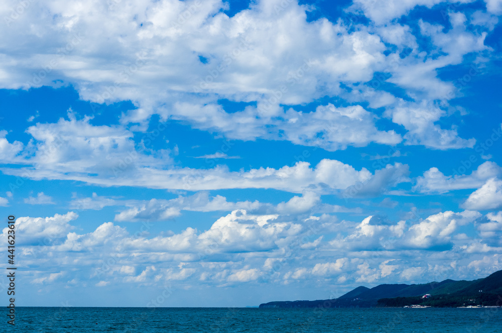 sea landscape is a pebbly beach with waves in white foam