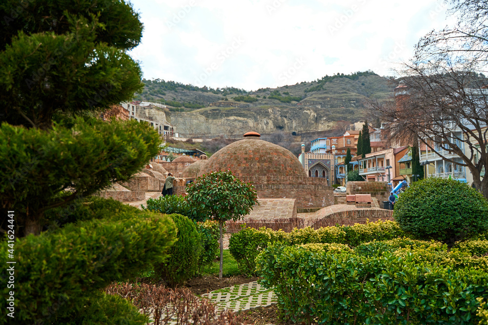 Naklejka premium Popular city landmark in Tbilisi. Ancient underground complex of sulfur baths