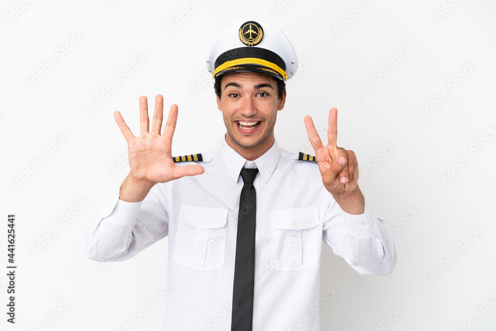 Airplane pilot over isolated white background counting seven with fingers Airplane pilot over isolated white background counting seven with fingers