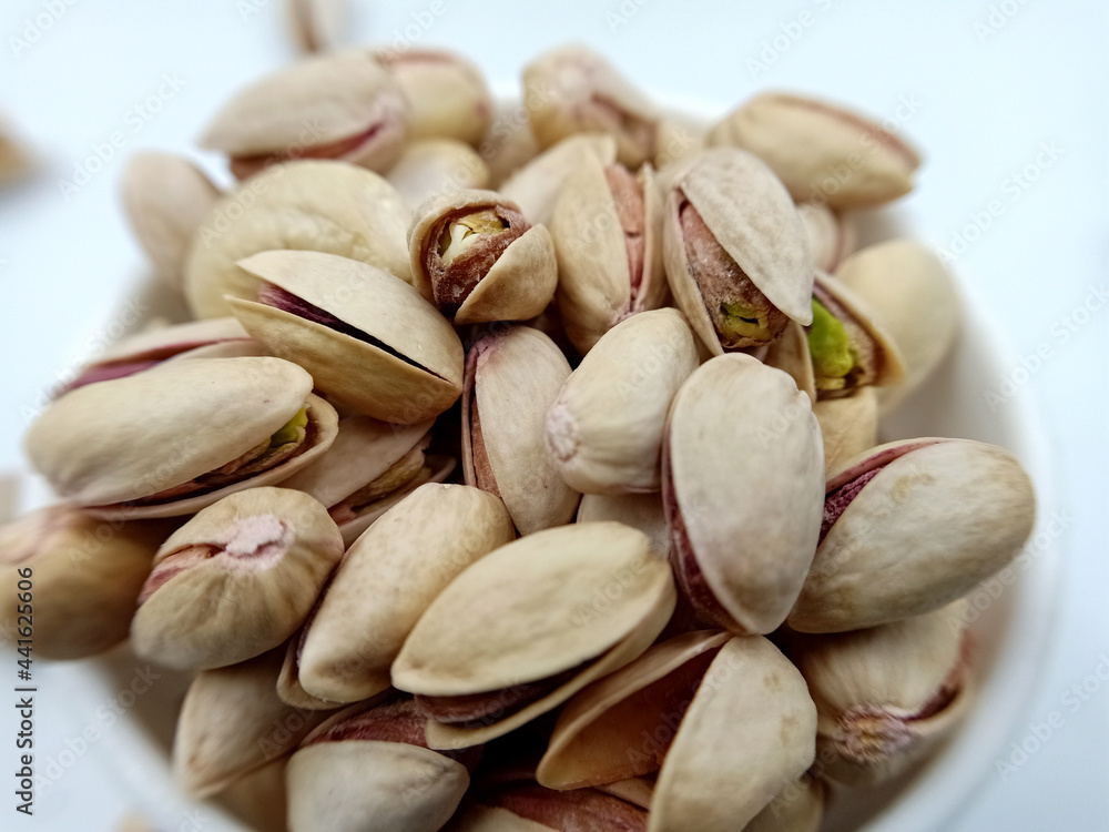 pistachio nuts on white background pistachio nuts on white background