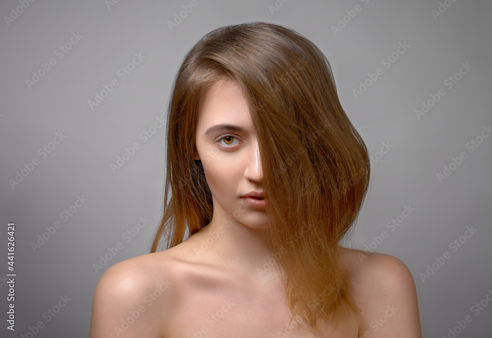 beautiful serious woman portrait, brunette staring at camera hair cover her half of face beautiful serious woman portrait, brunette staring at camera hair cover her half of face