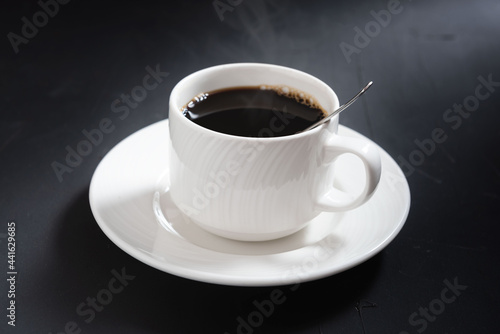 Cup of coffee isolated on black background