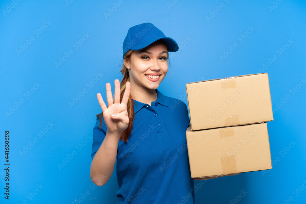 Delivery girl over isolated blue wall happy and counting four with fingers Delivery girl over isolated blue wall happy and counting four with fingers