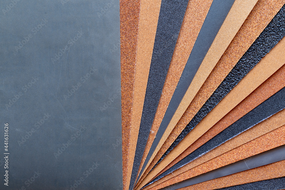 The background of the sandpaper surface, where the grains of sand on