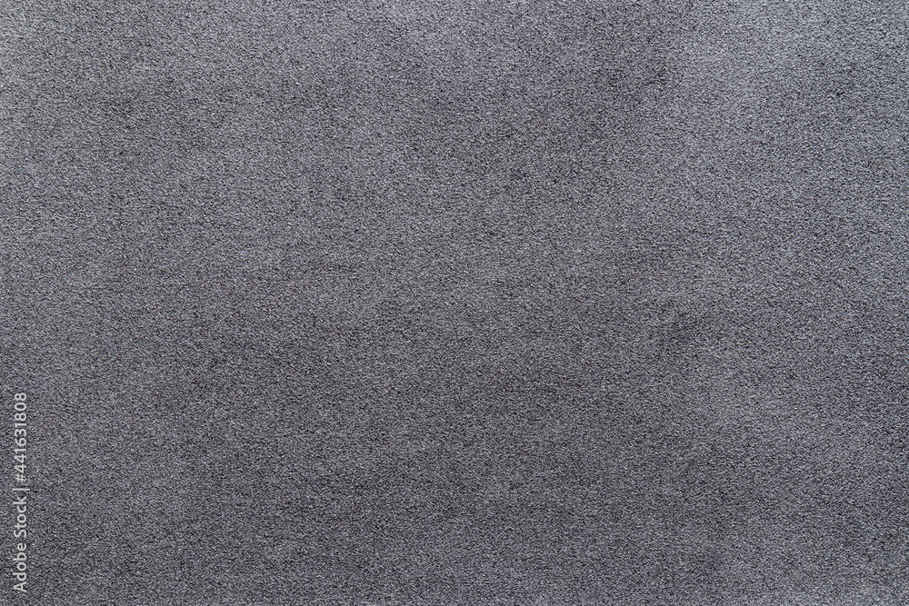 Obraz premium Sandpaper texture background makes the pattern of sand grains on sandpaper look beautiful. It is suitable as background to use in texting because there is Copy Space for designers to use on sandpaper.