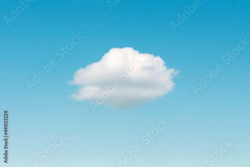 Little lonely white cloud in blue sky background