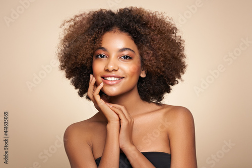 Beauty portrait of African American girl with afro hair. Beautiful black woman. Cosmetics, makeup and fashion photo