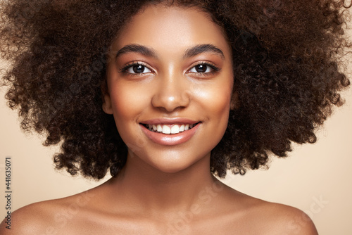 Beauty portrait of African American girl with afro hair. Beautiful black woman. Cosmetics  makeup and fashion