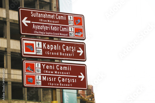 selective focus Signboard with the names of Istanbul's most crowded district, Eminönü, and the touristic places around it. tourist sign, guide sign.