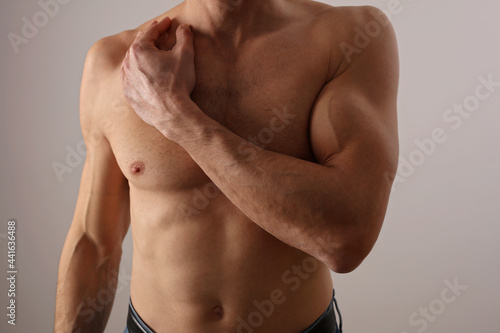 Stronge Muscular male body, biceps muscles close up.Working out, sport motivation, active lifestyle concept