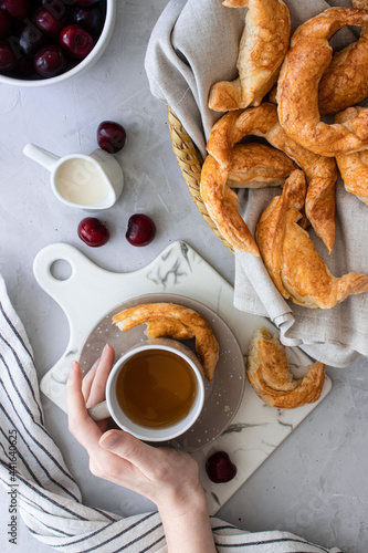 breakfast tea with pastries on white background