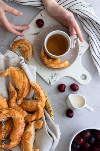 breakfast tea with pastries on white background