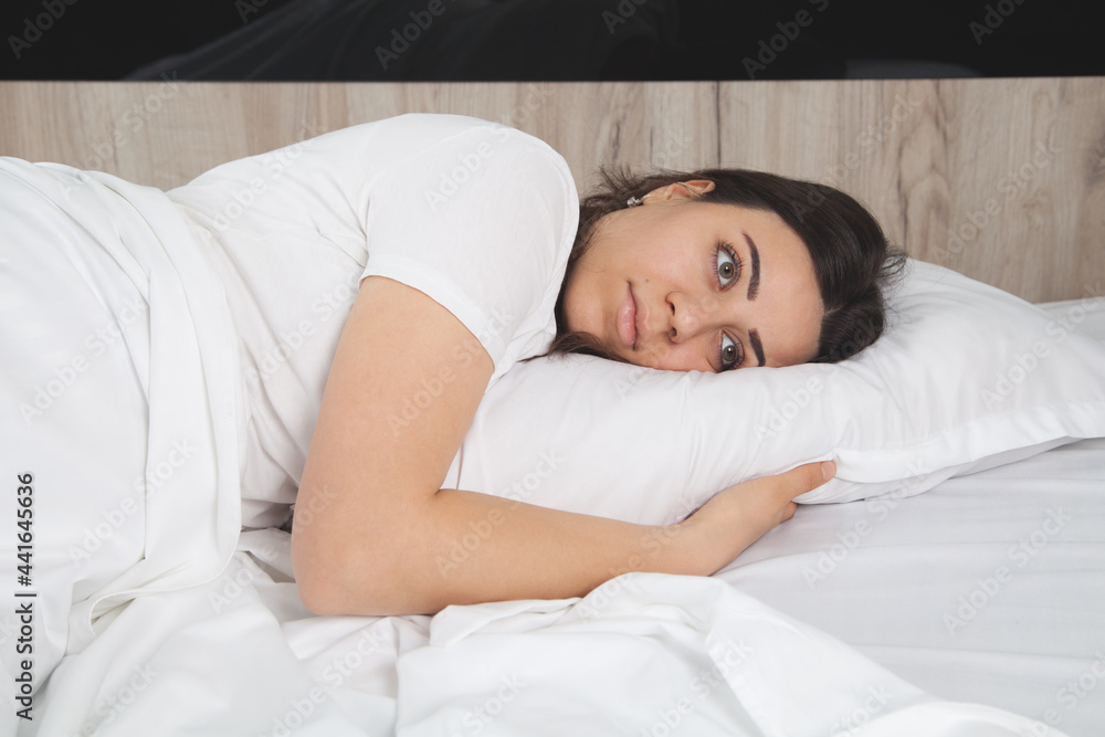 Upset sad woman suffering from in bed. Woman looking sad. Upset sad woman suffering from in bed. Woman looking sad.