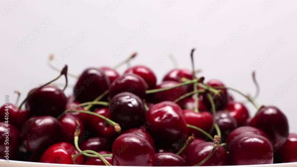 Rotating Fresh Ripe Berries Black Cherry On A White Background. Rotating Fresh Ripe Berries Black Cherry On A White Background.