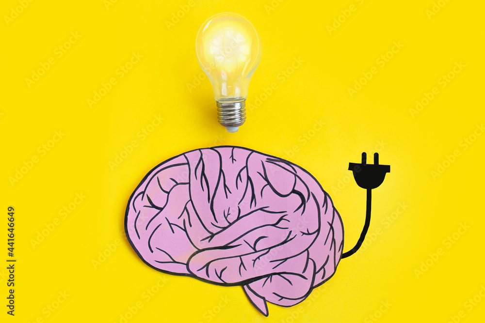 yellow brain with lamp shining