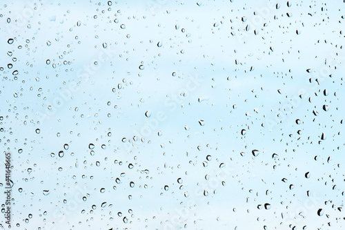 Raindrops on the window pane. Background for the inscription