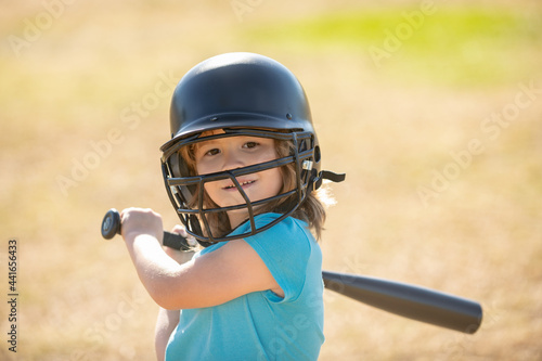 Little boy posing with a baseball bat. Portrait of kid playing baseball. © Volodymyr