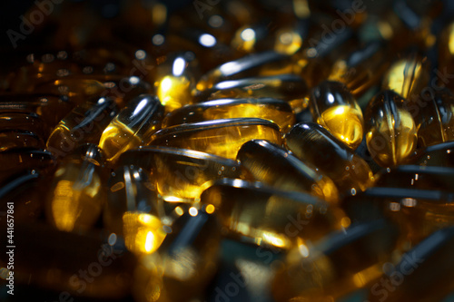 capsules on a dark surface