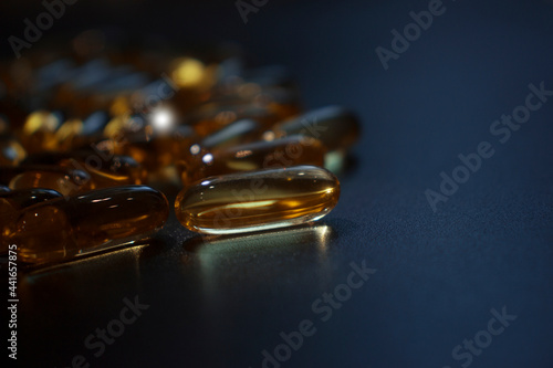 capsules on a dark surface