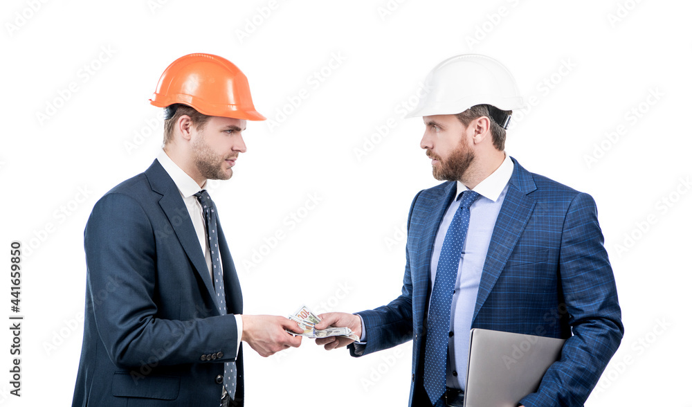 confident businesspeople men in suit and safety helmet giving money and hold computer, bribe