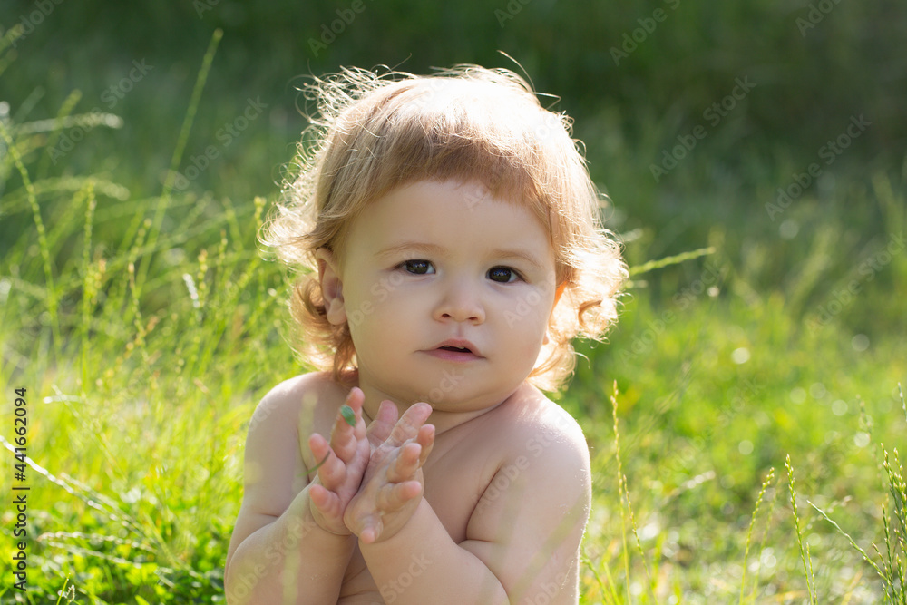 Kids portrait, close up head of cute summer baby in nature park. Kids portrait, close up head of cute summer baby in nature park.