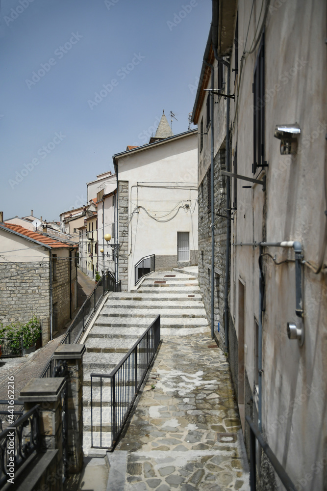 A small street between the old houses of Poggio del Sannio, a medieval village in the Molise region. A small street between the old houses of Poggio del Sannio, a medieval village in the Molise region.