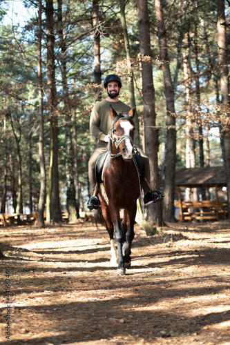 Riding Man Is Training His Horse © Jale Ibrak