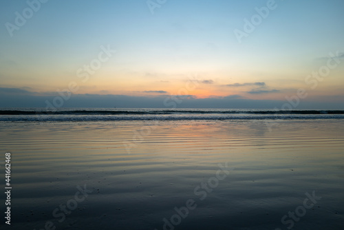 Calm sea ocean and sky background. Sea water landscape with clouds on horizon. Natural tropical water paradise.
