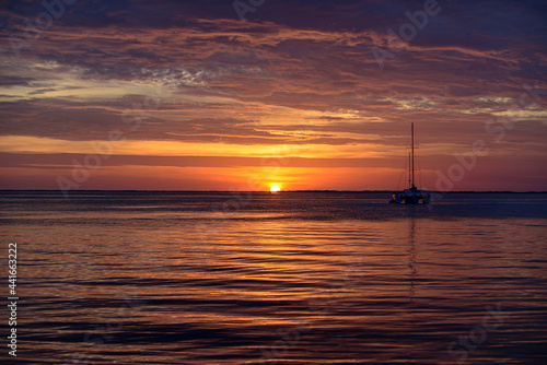 Seascape. Boat on sea. Sailboats at sunset. Ocean yacht sailing along water. © Volodymyr