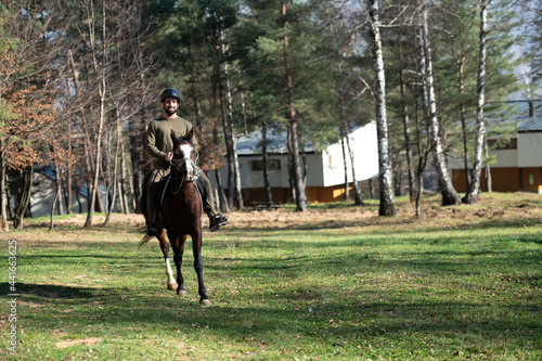 Riding Man Is Training His Horse © Jale Ibrak