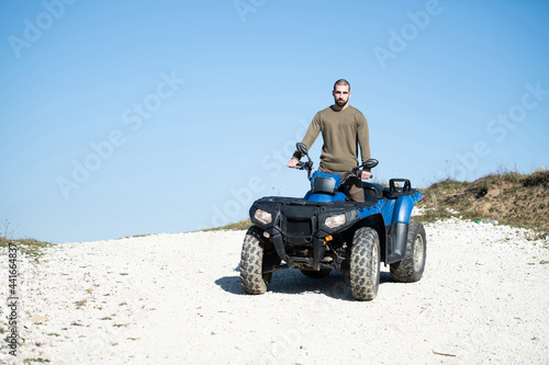 Man Driving Off-road With Quad Bike or Atv